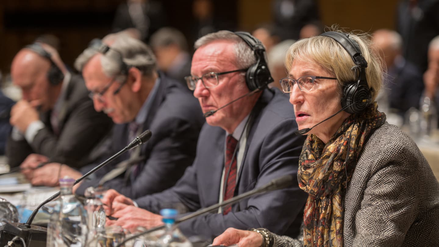 Beneath the Flags of Nations: A Dispute Over Peace in an Age of Enrichment