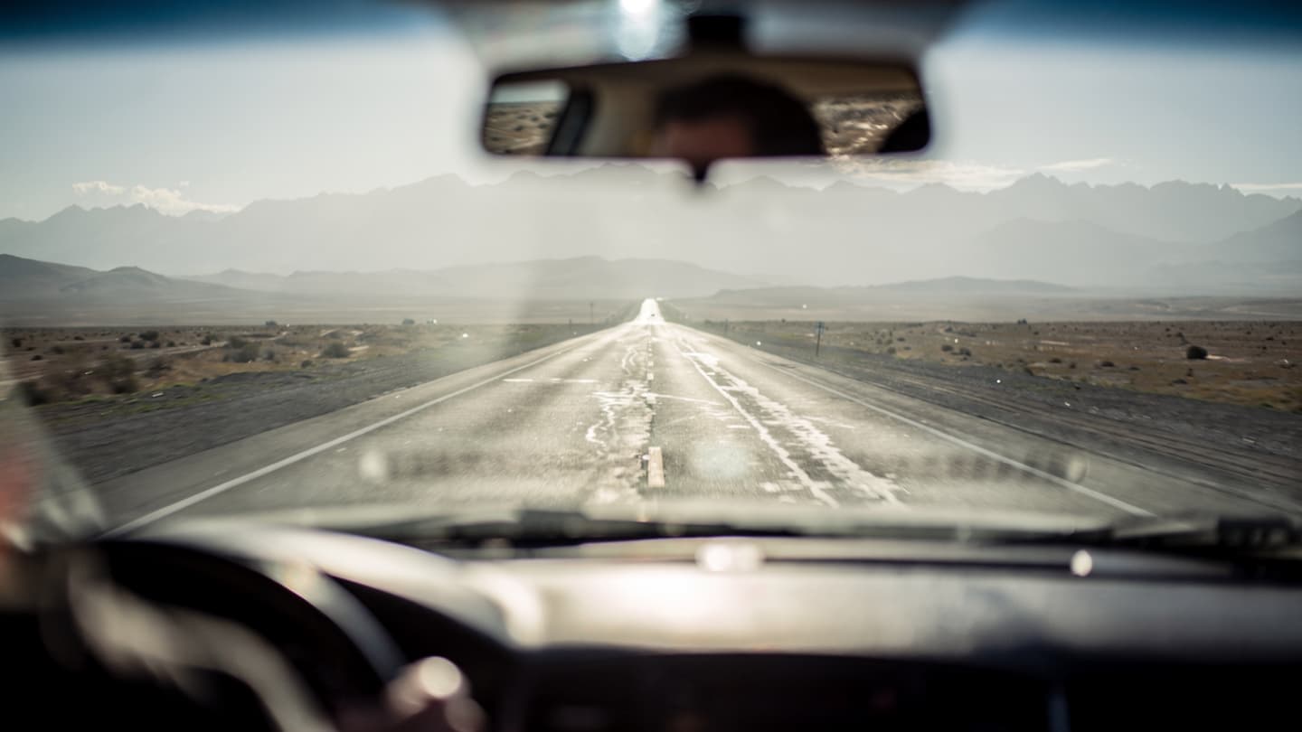 Of Asphalt Ribbons and Empty Tanks: A Quiet Observation of the Shifting Drive