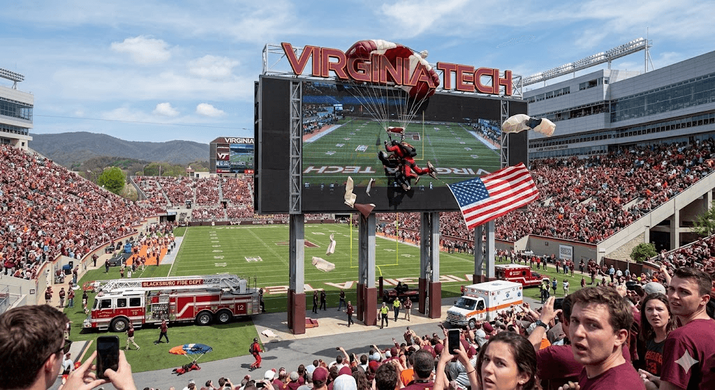Freefall Disaster: Skydiver Slams into Stadium Scoreboard During Virginia Tech Event