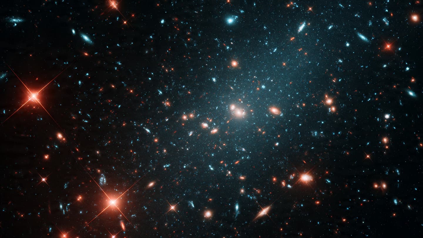 Tiny red lights in space may hide the universe’s most powerful secrets